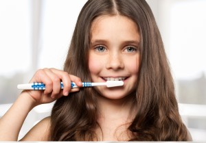 Girl Brushing Teeth so She Can Have Healthy Teeth